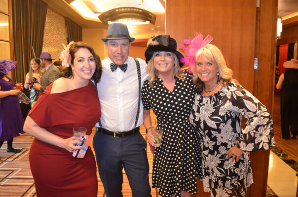 Two couples enjoying BCI Derby After Dark Gala