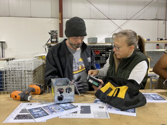 Student and teacher working together at the BCI Skills Center