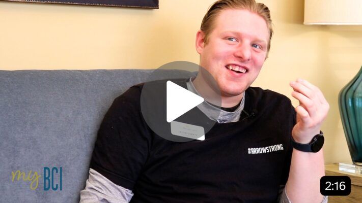 Photo of young man smiling during an interview