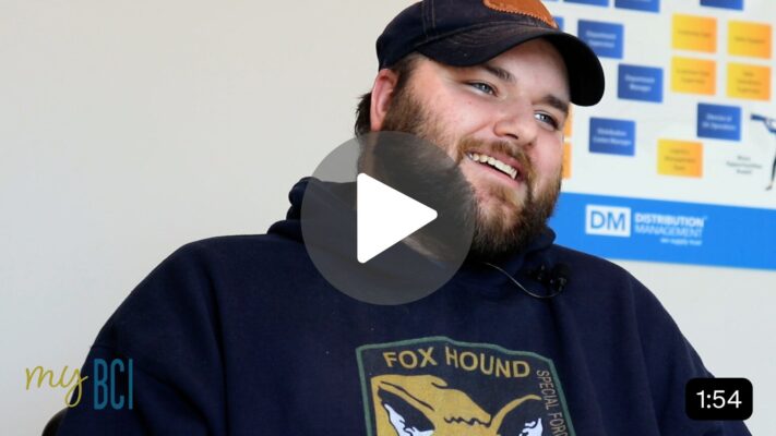 Photo of young man smiling during interview