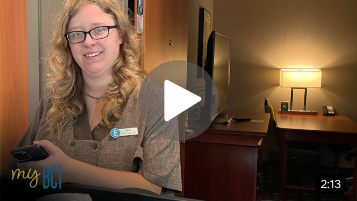 Young woman with disabilities in Embassy Suites uniform
