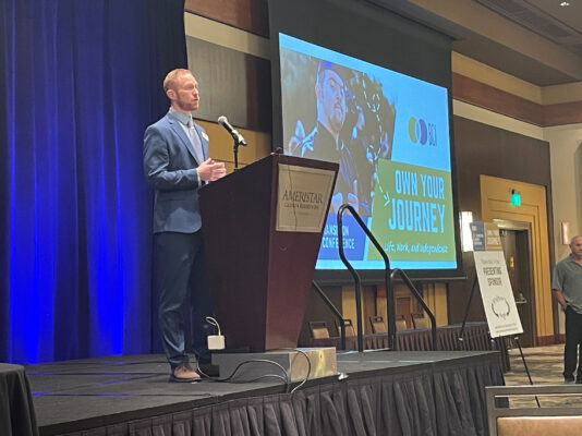 Emcee speaking from podium