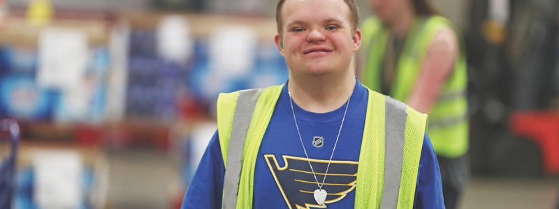 Young man with Down Syndrome working at BCI