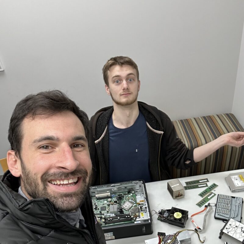 BCI Employment Advisor Sam works with his client as he disassembles a computer