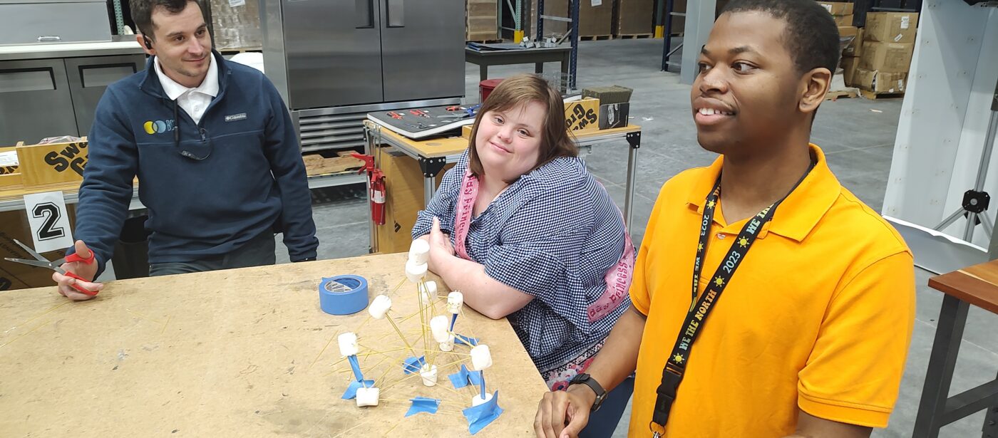 Two Pre-Employment participants with disabilities and their instructor doing an activity